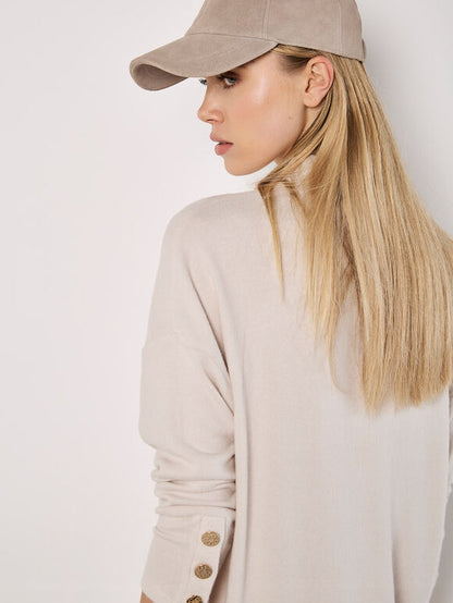 A soft-milky white, tubular-shaped mini knitted dress